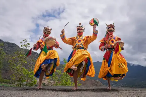 Masked dancers performing at a Bhutanese tshechu